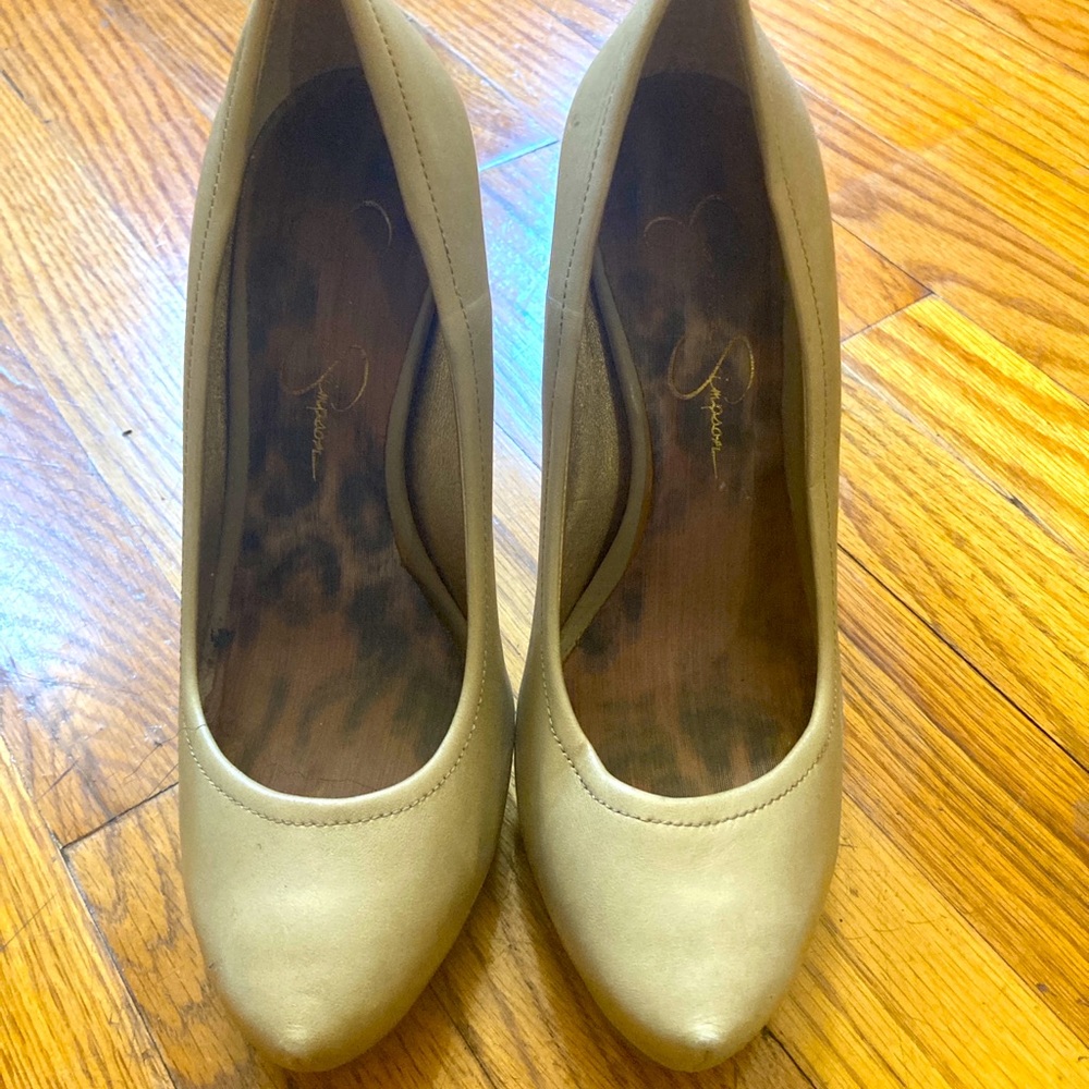 Light tan pointy toe high heeled pumps